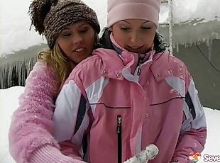 Lesbian chicks warming up by having sex outdoors in the snow