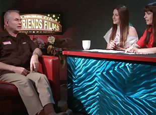 Pornstars host a talk show with a producer on as their guest