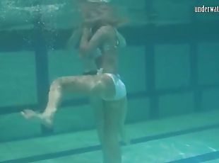 Retro footage of two underwater lesbians