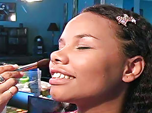 Doing makeup for cute black girl