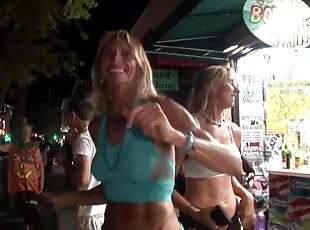 Topless girls with body paint walking around in public