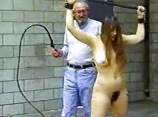 Old man whips a girl in bondage