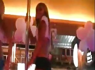 Super hot party girls dancing on stage in the night club