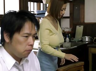 Big-breasted Japanese milf favours a man with a titjob