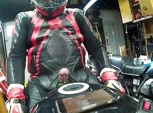 Leather biker milked on his motorcycle