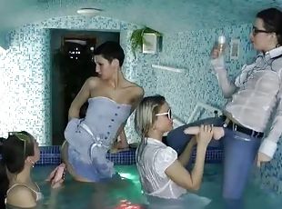 Clothed lesbian dildo play in hot tub