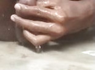 Cute petite boy pissing on her own body. Self piss bathing