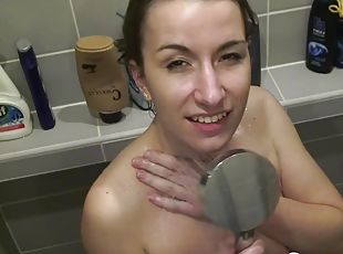 Showering brunette babe masturbates with her fingers