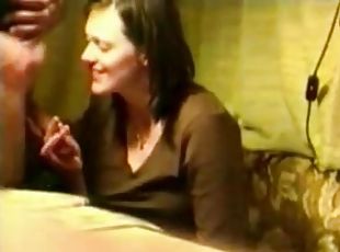 Brunette milf giving some guy head without any idea she is being filmed.