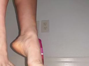 Lubed soles playing with dildo