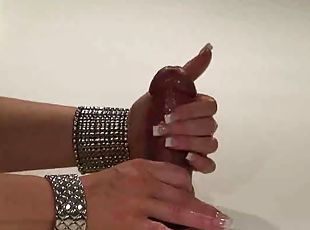 Touching cock and giving a slow handjob