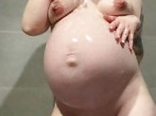9 month pregnant woman masturbates in the shower