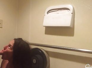 Brunette skank takes it from behind in public toilet