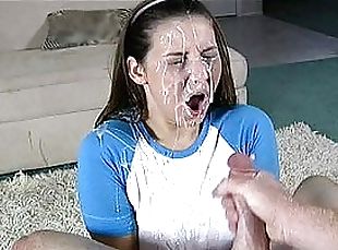 Pretty brown-haired chick gets her face covered in cum
