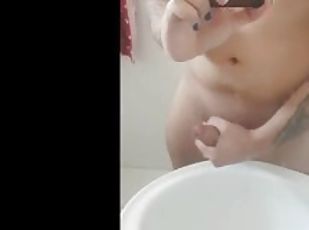 alternative trans cumming in front of the mirror