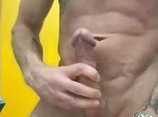 Fit guy with big cock cumming in public toilet