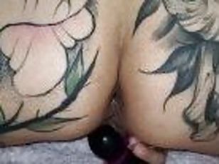 Tattooed teen fucks her own ass (closeup)