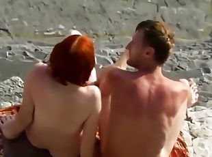 Sexy Red Haired Woman Blowjob On Nudist Beach