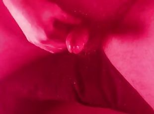 Masturbating with an overhead view with nice red lights