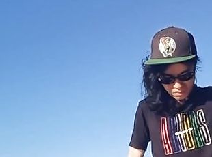 Risky public masturbation, cumshot outside, outdoors, by the water, of a twink with long black hair