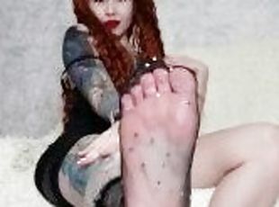 Foot fetish from a hot tattooed girl in a dress and socks