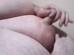 I lift my little dick and watch a porn movie and cum